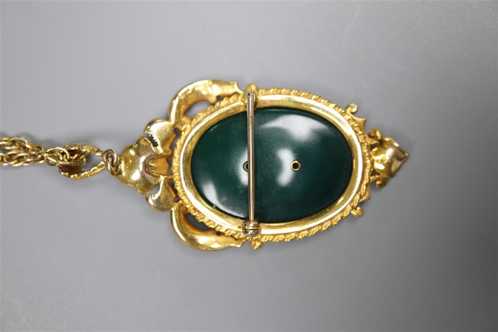 A 1970s 9ct gold and chrysophase set oval flower and scroll pendant brooch, on a multi-link 9ct chain,